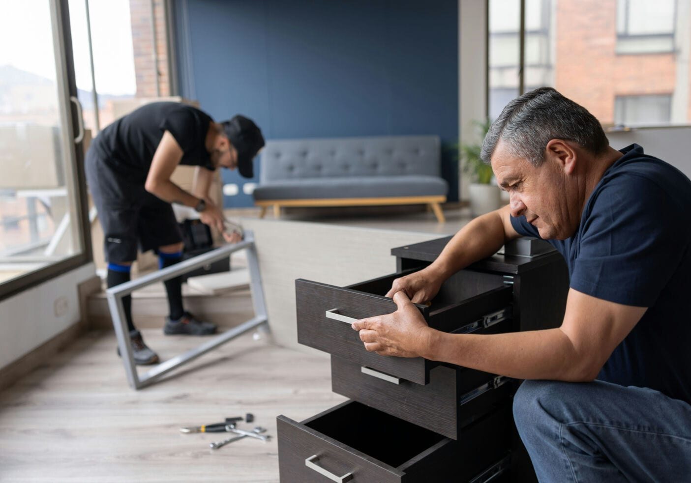 movers assembling furniture