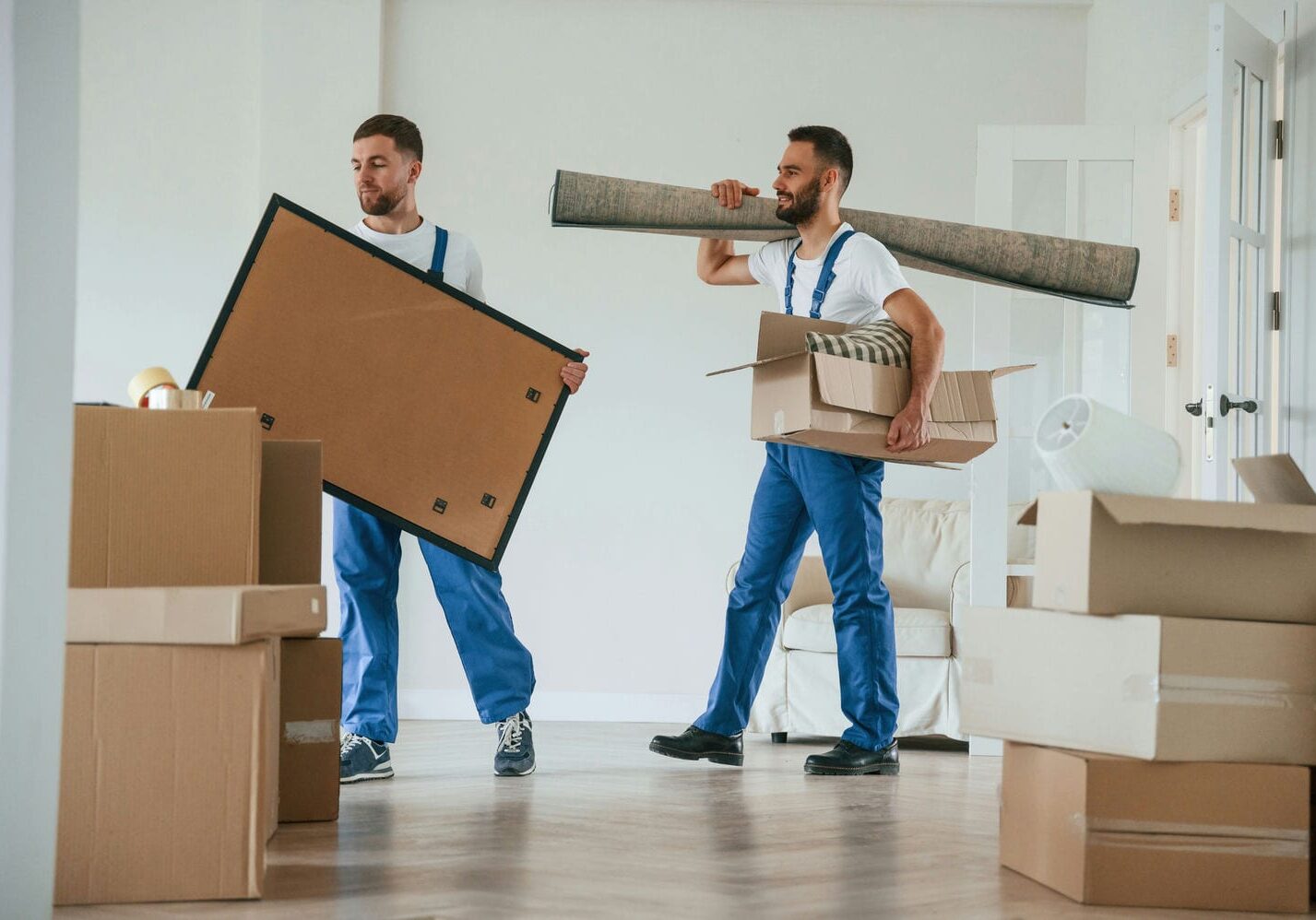 movers bringing items into new home