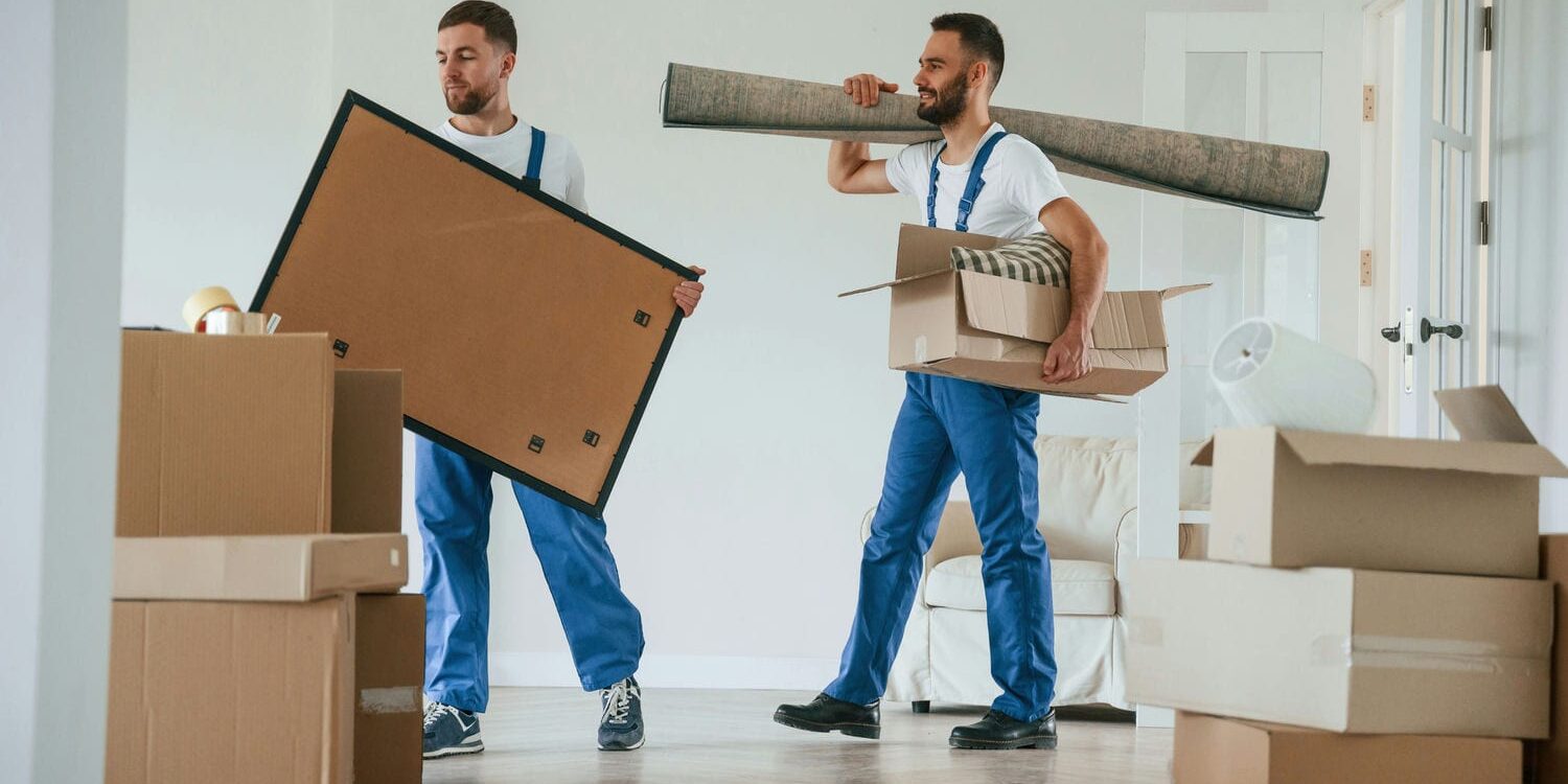 movers bringing items into new home